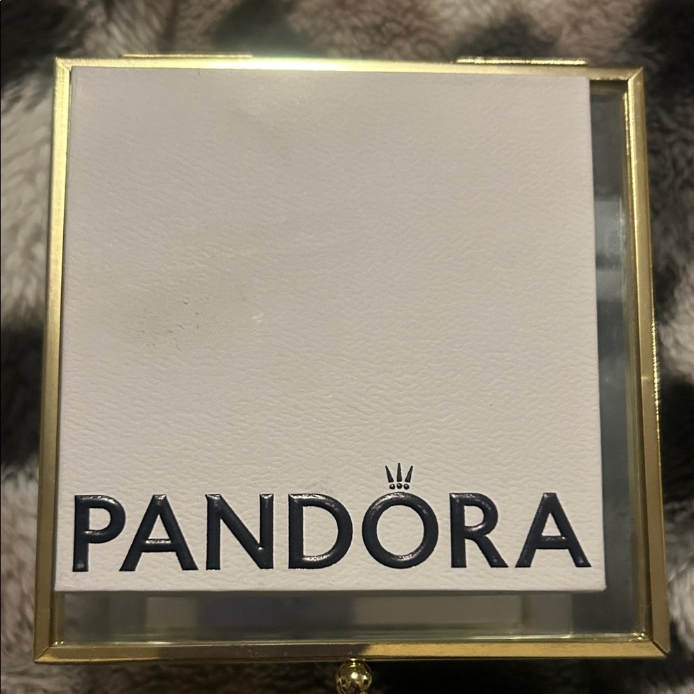 Pandora silver bracelet with heart shaped clash and stars.